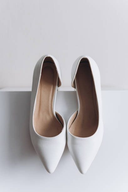 istock white wedding shoes of bride 2183229338