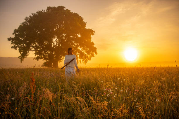 istock Serene Sunset Melody Caucasian Female Flutist by Lone Tree 2183230802