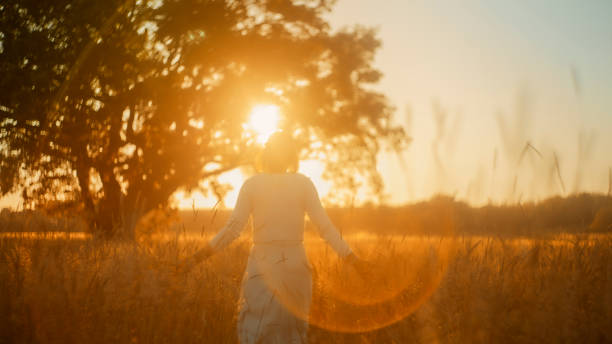 istock Serene Senior Woman Enjoying Sunset Meadow 2183231004