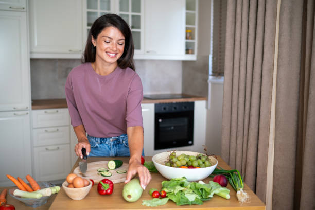 istock Woman cutting vegetables for dinner 2183233813