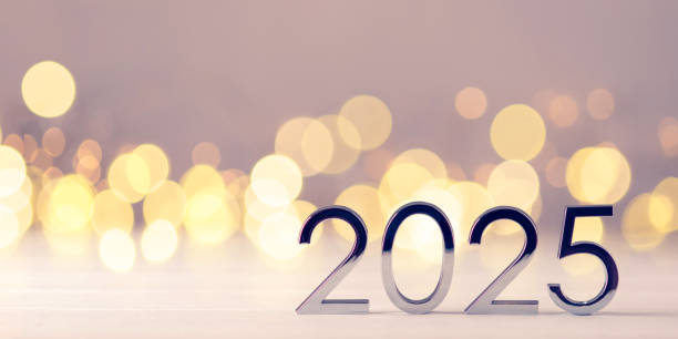 istock Metal numbers 2025 on table with bokeh lights. 2183234368