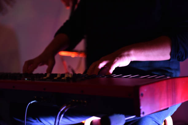istock Hands of keyboard player musician playing live 2183234992