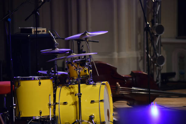 Yellow drum kit musical instrument on stage