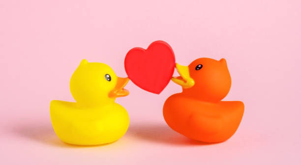 Many yellow color classic and generic rubber ducks are scattered to form a background or surface.