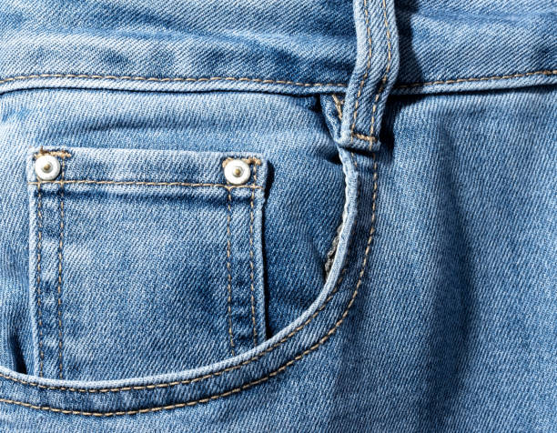 istock Front pocket and small pocket of blue jeans pants. Macro close up. 2183235563