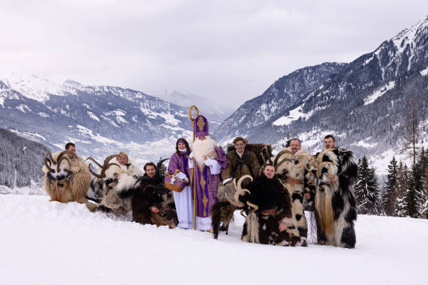 istock Traditional winter celebration with costumed figures in snow-covered mountains during a festive gathering 2183237719