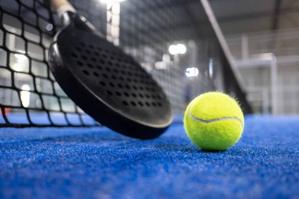 istock Paddle tennis racket and balls on blue turf 2183238662