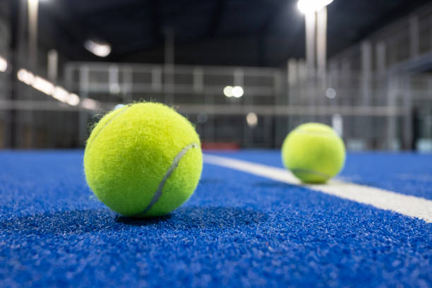 istock Paddle tennis racket and balls on blue turf 2183238664