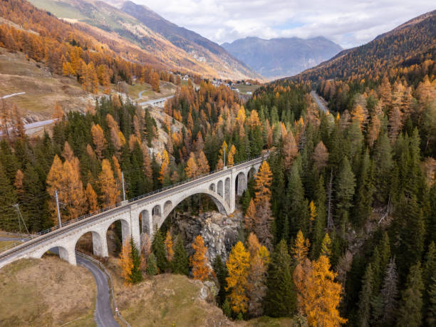 istock Scenic Stone Bridge Over Valley in Autumn Forest 2183239881