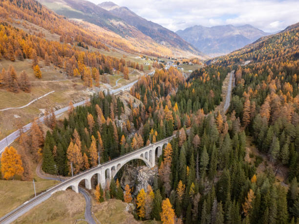 istock Scenic Stone Bridge Over Valley in Autumn Forest 2183239895