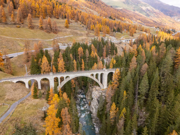 istock Majestic Stone Arch Bridge in Alpine Autumn Forest 2183239930