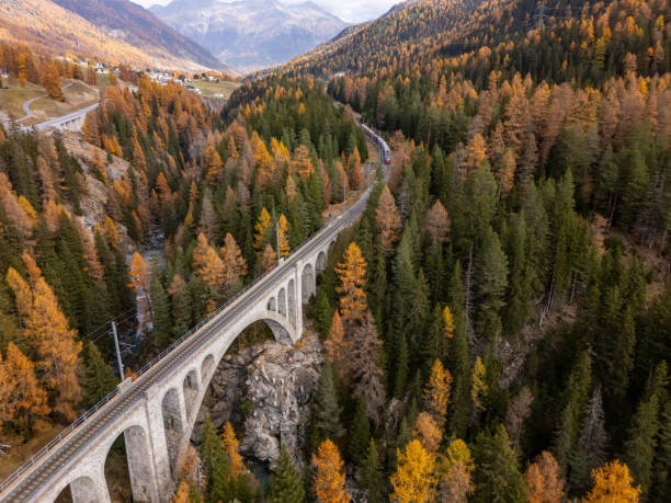 istock Scenic Stone Bridge Over Valley in Autumn Forest 2183239964