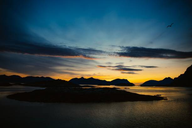 istock Serene sunset over mountains with bird in flight. 2183240078
