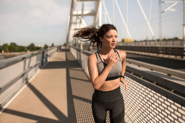 istock Athletic woman running outdoors. 2183242211
