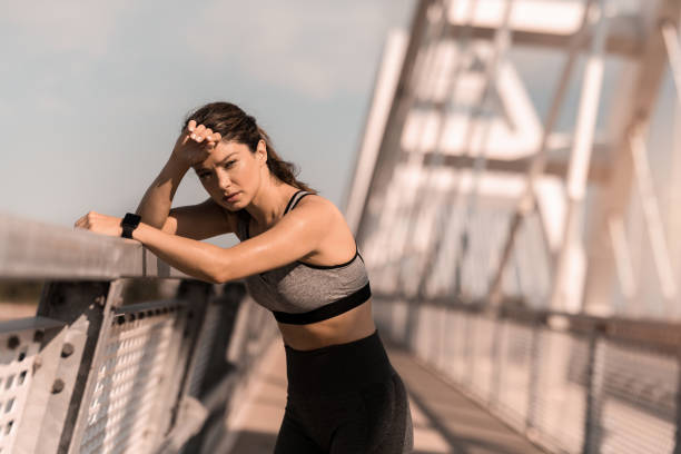 istock Athletic woman resting on the bridge 2183244022
