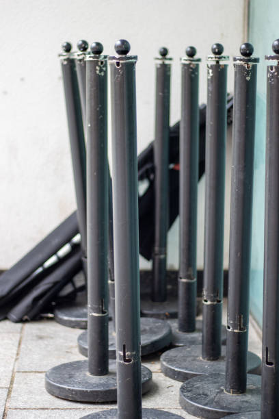 istock group of posts and bases for crowd control and making lines 2183244874
