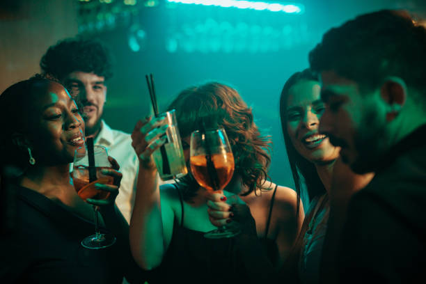 istock People proposing a toast at the nightclub 2183244950