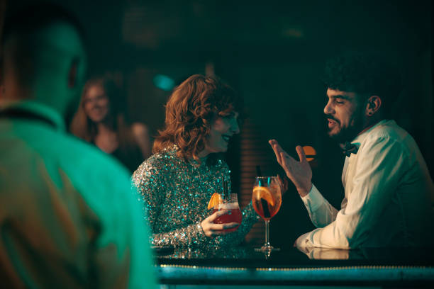 istock Two young people having a conversation at a nightclub 2183244952