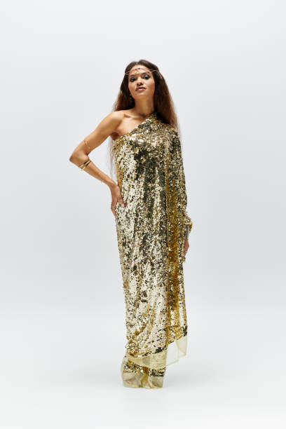 istock A stunning African American goddess in a sequined gown posed in the studio 2183245584