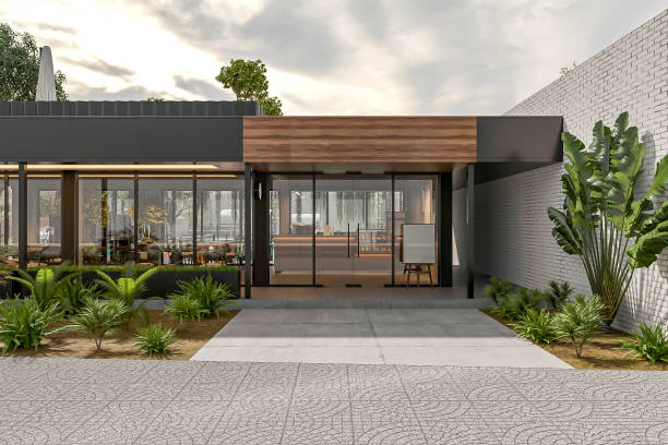 istock Modern Office Building Entrance with Glass Doors and Green Landscaping 2183246980