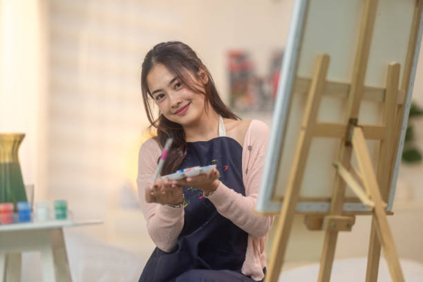 istock Woman Painting at Home Studio 2183248864