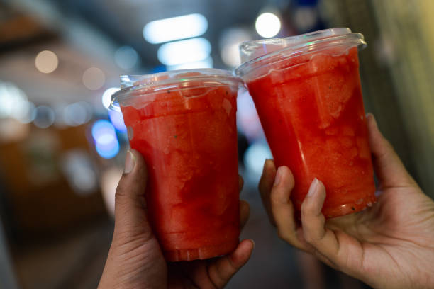 istock Two glasses of watermelon smoothie in take away cup. 2183249968