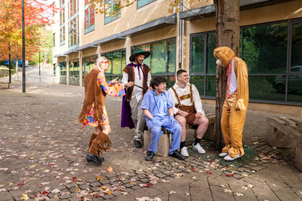 Friends in Fun Costumes in autumn