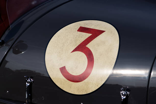 istock red number 3 in a white circle on the front to an old fashioned racing car 2183251104