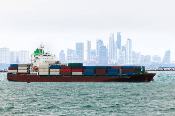 shipping logistic concept, cargo container ship sailing in sea import export goods and distributing products to dealer and consumers across worldwide, by container ship transport business, industry delivery service.  aerial view.