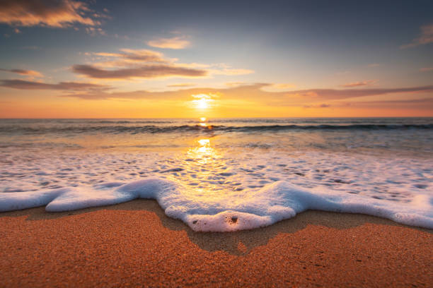 istock Beautiful sunrise over the sea shore and sandy beach 2183252944
