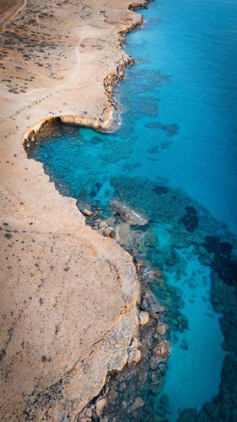 istock Aerial view of rugged coastline with turquoise waters. 2183253612