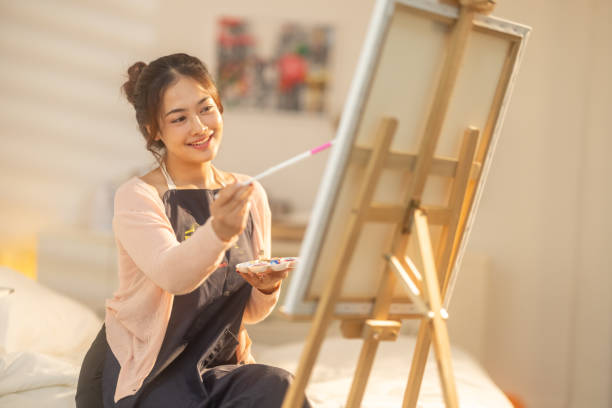 istock Woman Painting at Home Studio 2183255702
