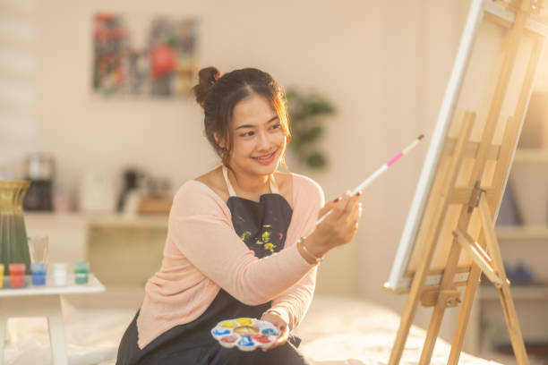 istock Woman Painting at Home Studio 2183255767