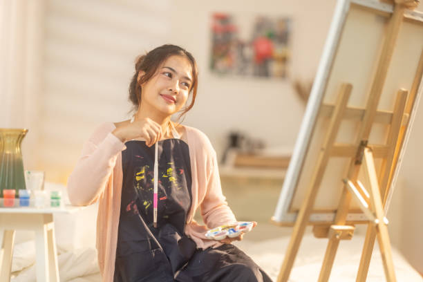 istock Woman Painting at Home Studio 2183255817