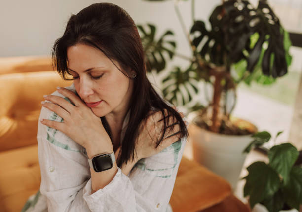 istock Woman Experiencing Stress While Sitting in a Cozy Living Room 2183256407