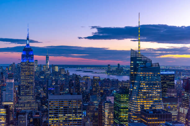 istock Skyscrapers in Manhattan under a purple sky at sunset 2183260762