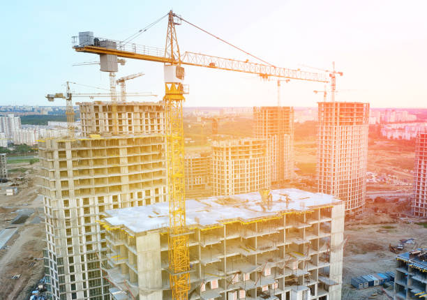 istock Construction crane on Housing, aerial shot. Construction site with buildings under construction, drone view. 2183261244