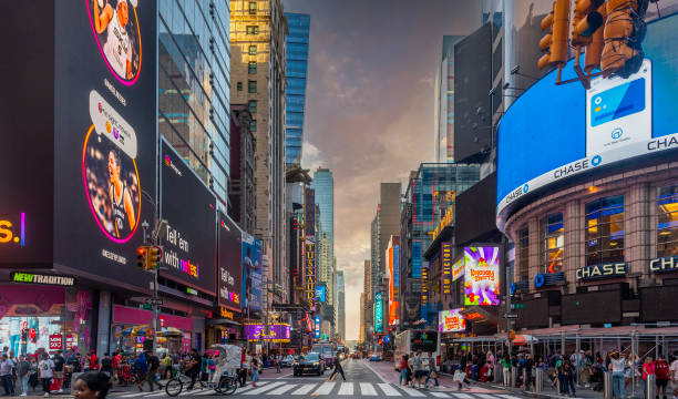 New York, USA - October 06, 2024: People in Midtown Manhattan at sunset