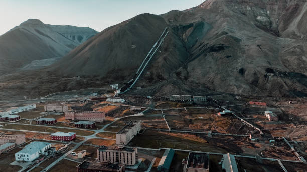 istock Abandoned buildings and scenic mountains in Pyramiden, Svalbard at twilight 2183262601