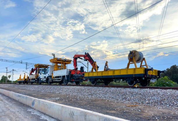 Truck on railroad construction. Rail road Platform with Crane for construction. Work on overhead lines on railroad. Railroad road vehicles truck. Service and repair of electrical networks on railway.