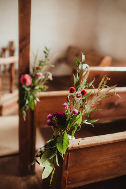istock Wedding flowers decorating church pew before ceremony 2183262834