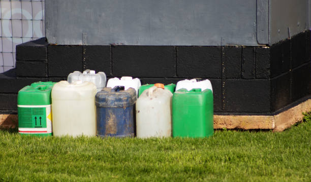 istock two lines of old used plastic chemical containers repurposed 2183263749