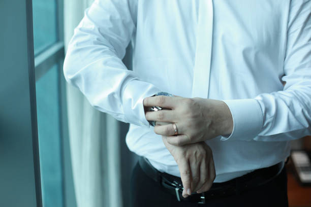 Professional man, fine gentleman, business executive fitting to their suit and preparing for daily office job, dressing to gentleman suit good for executive magazine or multimedia content creation