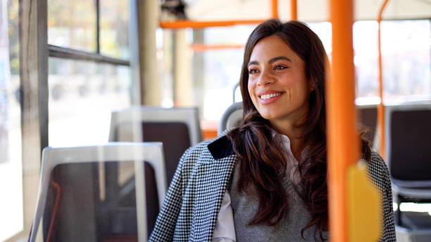 istock Charming young woman taking in the city views while riding a bus 2183276223