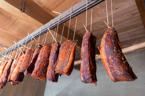 istock Sausages drying in the smokehouse 2183276516