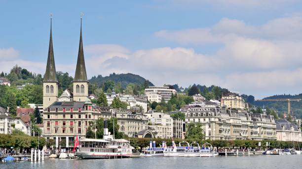 yacht is sailing on the Lucerne Lake.A city of central Switzerland on the northern shore of the Lake of Lucerne, an irregularly shaped lake surrounded by mountains.It is known as Switzerland's most beautiful, the most ideal tourist cityWhen you see Lucerne lakefront buildings,You'll feel a high degree of harmony between human and nature-This view is absolutely breathtaking!