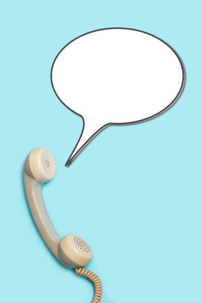 istock Vintage telephone handset with a blank speech bubble on a light blue background with copy space 2183280486