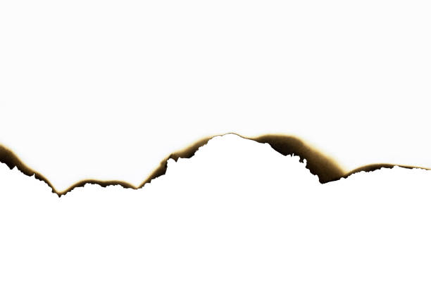istock White paper burned edges isolated on white background with clipping path. 2183280794