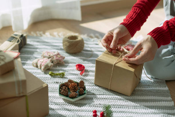 istock Woman wrapping Christmas presents 2183282183