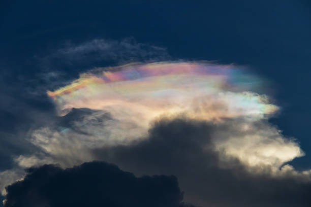 istock A stunning iridescent cloud formation against a dark sky, showcasing beautiful colors and striking patterns in nature. 2183282316